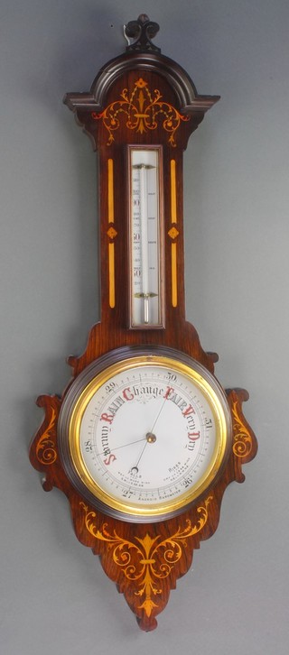 An Edwardian aneroid barometer and thermometer with porcelain dial contained in an inlaid rosewood wheel case 