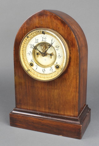 An Edwardian Ansonia striking mantel clock with visible escapement,enameled dial with Arabic numerals and contained in a mahogany lancet case 
