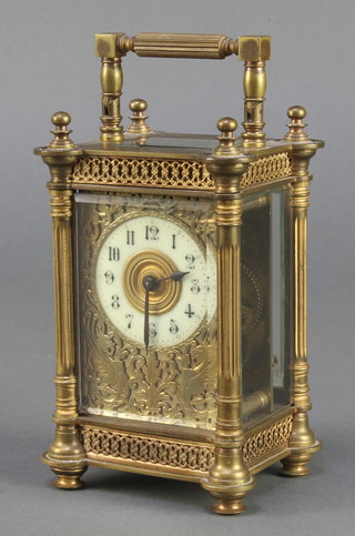 A French 19th Century 8 day carriage clock with gilt dial, enamelled chapter ring and Arabic numerals contained in a gilt metal case, the back plate marked R & Co Made in France