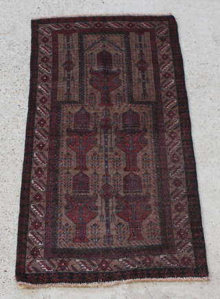 A brown ground Belouch prayer rug 59" x 31" 