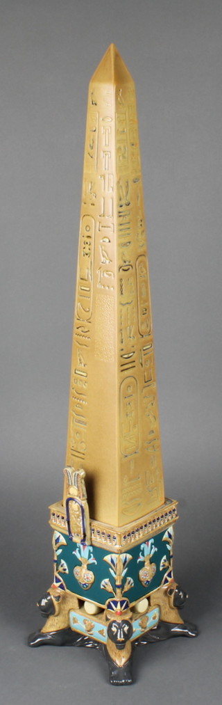 A Lladro beige ground Thotmes 1 Egyptian obelisk with lion mask feet 24 3/4" 