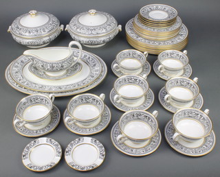 A Wedgwood black and gilt part dinner service comprising 8 two handled cups, 5 saucers, 8 small plates, 8 medium plates, 8 large plates, tureen and stand, 2 oval meat dishes, 2 tureens with lids, 2 ashtrays 