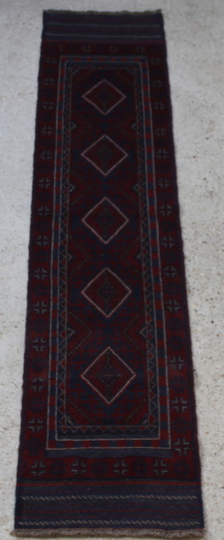 A red and blue ground Meshwani runner with 5 octagons to the centre 102" x 23" 