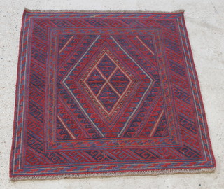A red and blue ground tribal Gazak rug with diamond shaped medallion 49" x 47" 