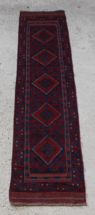 A red and blue ground Meshwani runner with 5 diamonds to the centre 104" x 24"  