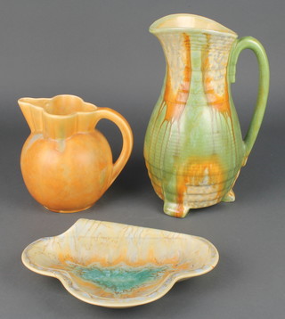 An Art Deco slip glaze jug 11", an orange ground ditto 6" and a trefoil dish 9" 