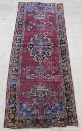 A Persian Malayer red and floral ground runner 127" x 45" 
