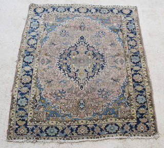 A sand, blue and white ground Persian Tabriz rug with central medallion 71" x 54 1/2" 
