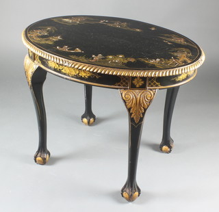 A 1920's oval black lacquered chinoiserie centre table with gadrooned border raised on carved ball and claw supports 28"h x 36"w x 26"d 