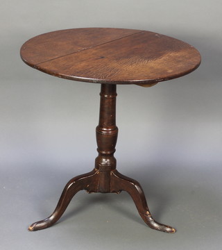A 19th Century oak snap top tea table, raised on a turned pillar and tripod support 28"h x 27" diam. 