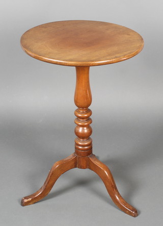 A 19th Century circular mahogany snap top wine table raised on a column and tripod base 26"h x 18" diam. 