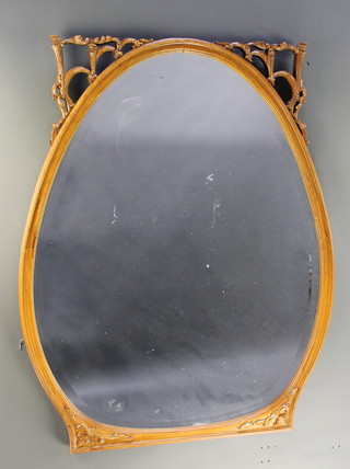 An oval bevelled plate wall mirror contained in a mahogany frame 41"h x 32"w 
