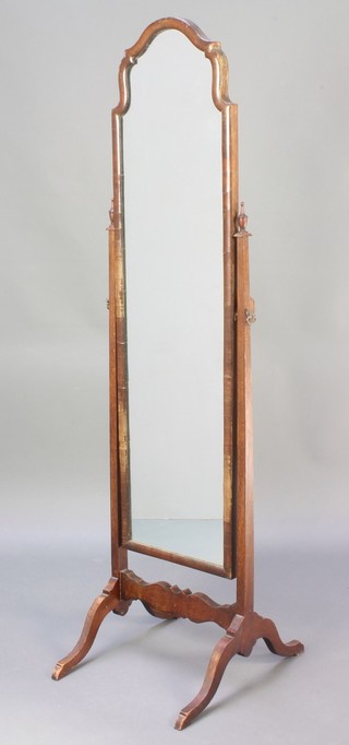 A Queen Anne style arch shaped cheval mirror contained in a walnut frame 60"h x 16"w x 20"d  