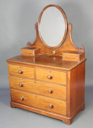 A Victorian mahogany dressing chest with oval plate mirror above 2 glove drawers, the base fitted 2 short drawers above 2 long drawers, raised on bracket feet 61"h x 40"w x 21 1/2"d 
