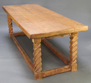 A pine and elm refectory dining table, the top formed from 3 planks, raised on spiral turned supports with box framed stretcher 30 1/2"h x 35"w x 96"l 
