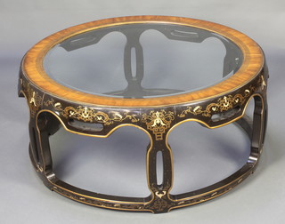 A Chinese style circular lacquered occasional table with bevelled plate glass top 18"h x 38"diam. 