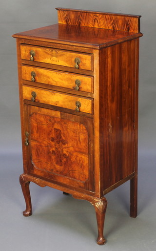 A Queen Anne style figured walnut music cabinet, the upper section with raised back fitted 3 long drawers above a cupboard on cabriole supports 43"h x 21"w x 14 1/2"d 