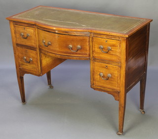 An Edwardian inlaid mahogany bow front side table, with green inset writing surface, fitted 1 long and 2 short drawers, raised on square tapered supports 32 1/2"h x 44"w x 20"d 
