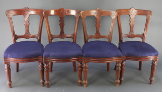 A set of 4 R J Reilly's Patent Edwardian carved walnut slat and bar back dining chairs with upholstered seats 