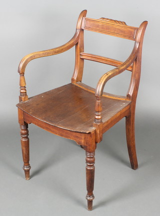A Georgian mahogany bar back carver chair with plain mid rail and solid seat, raised on turned supports 