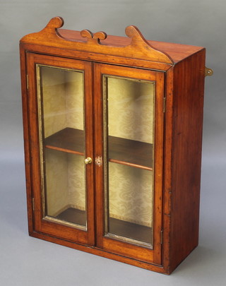 A 19th Century mahogany hanging display cabinet with shaped cornice, fitted shelves enclosed by glazed panelled doors 32"h x 22"w x 9"d 