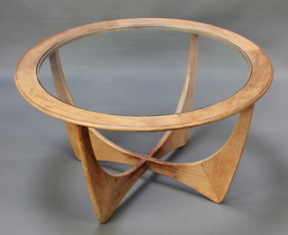 Victor Wilkins for G-Plan, a circular teak Astro coffee table with plate glass top 18"h x 33" diam. 
