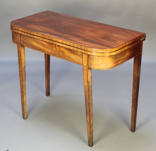 A 19th Century D shaped tea table with line inlay, raised on square tapered supports 29"h x 35"w x 17 1/2" 