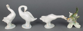 Three Lladro figures of standing geese 3" and a Goebel figure of a fire crest 3" 