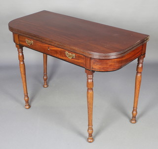 A Georgian mahogany D shaped tea table, fitted a frieze drawer and raised on turned supports 30"h x 42"w x 20" 
