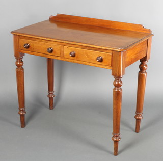 A Victorian mahogany side table with raised back, fitted 2 frieze drawers with tore handles, raised on turned supports 31"h x 35"w x 18"d 