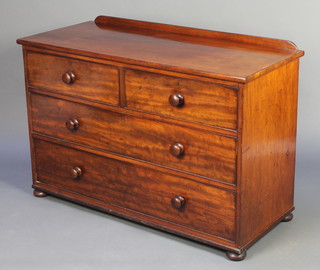 A Victorian mahogany chest with raised back, fitted 2 short and 2 long drawers, raised on bun feet 32 1/2"h x 48"w x 20 1/2"d 