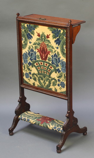 A Victorian carved rosewood adjustable fire screen fitted a folding shelf and with tapestry panel to the centre 32"h x 17"w x 12"d 