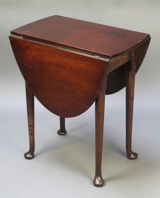 A 19th Century oval drop flap tea table raised on club supports 27"h x 34"w x 14" when closed x 42" when open 