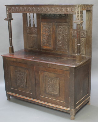 A 17th/18th Century oak court cupboard with raised carved and pierced back, panel decoration, the base fitted a cupboard enclosed by panelled doors 59"h x 51"w x 22"d (possibly made up) 
