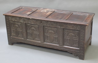 An 18th/19th Century carved oak coffer of panelled construction with hinged lid 24"h x 57 1/2"w x 22"d 