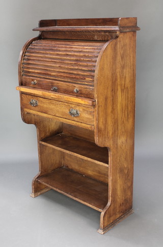 A Victorian oak student's roll top desk with three-quarter gallery and fitted interior, with drawer above recess, 46"h x 26 1/2"w x 14"d 