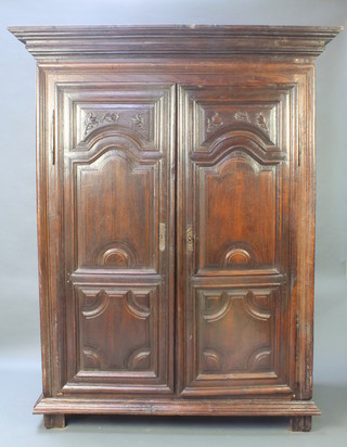 A 17th/18th Century Continental oak armoire of panelled construction with moulded cornice, the interior fitted a shelf     80"h x 63"w x 30"d