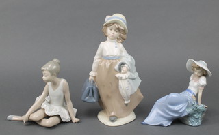 A Spanish porcelain figure of a lady 10", a Nao figure of a girl sitting on a rock 6" and another of a seated ballerina 6" 