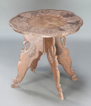 A Kashmir circular carved table, raised on folding stand 17"h x 18" diam. 
