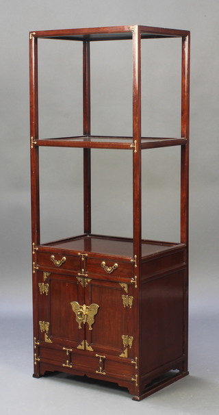 A rectangular Chinese hardwood 2 tier what-not the base fitted 2 drawers above a cupboard enclosed by a panelled door with gilt metal butterfly mounts 49 1/2"h x 18"d x 13"d 