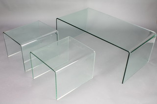A nest of 3 glass Ghost tables 16 1/2" x 43" x 23 1/2" and 14" x 19 1/2" x 17" 
