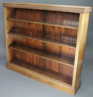 Weir & Hamilton of Glasgow, an Edwardian mahogany bookcase with fluted decoration, fitted adjustable shelves, raised on a platform base 48"h x 56"w x 12"d 