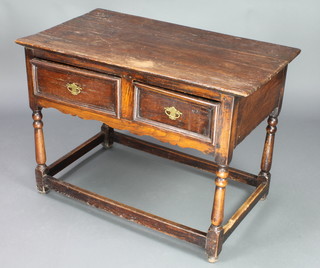 A 17th/18th Century oak side table fitted 2 frieze drawers, raised on turned and block supports with box framed stretcher 26 1/2"h x 37 1/2"w x 21"d 
