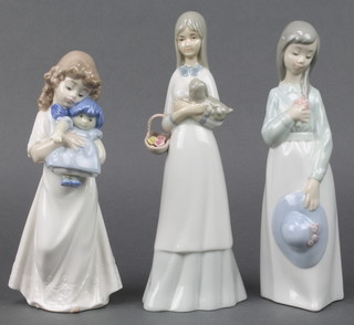 3 Nao figures - a girl with doll 8", a girl holding a hat 9" and a girl with a puppy 9" 