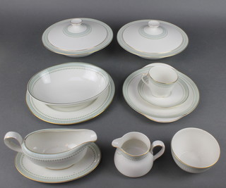 A Royal Doulton Berkshire pattern tea and dinner service comprising 20 tea cups, 18 saucers, 19 small plates, 18 medium plates, 11 large plates, 18 dinner plates, 2 tureens and covers, 1 sandwich plate, 1 sugar bowl, 2 cream jugs, 2 sauce boats and 1 stand, 3 oval dishes and 2 serving plates