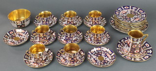 A matched Imari pattern tea set comprising 8 tea cups, 7 saucers, milk jugs, sugar bowl, 12 small plates, 1 sandwich plate 