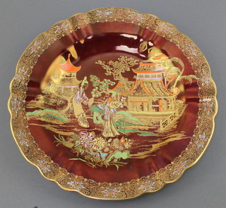A Carlton Ware Rouge Royale plate decorated with figures in an Oriental garden 9" 