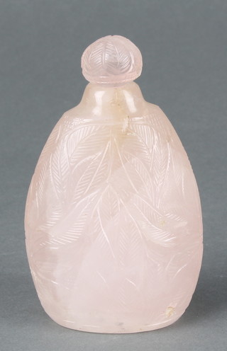 A 19th/20th Century Chinese carved rose quartz globular flattened scent bottle with stopper, decorated with leaves 4" 