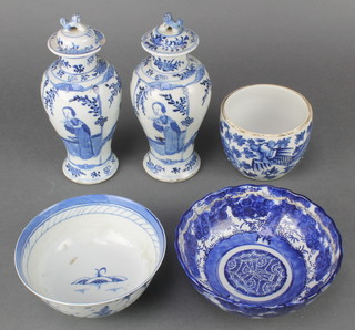 A pair of early 20th Century Chinese oviform vases and covers decorated with figures on terraces 8" together with a blue and white vase and 2 bowls 