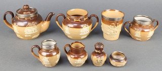 A 19th Century stoneware beaker with silver rim London 1881, a ditto teapot, jug and sugar bowl and salt, a pepper and jug 